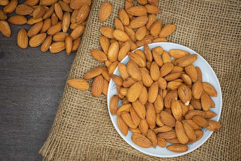 Almonds on a plate on the table