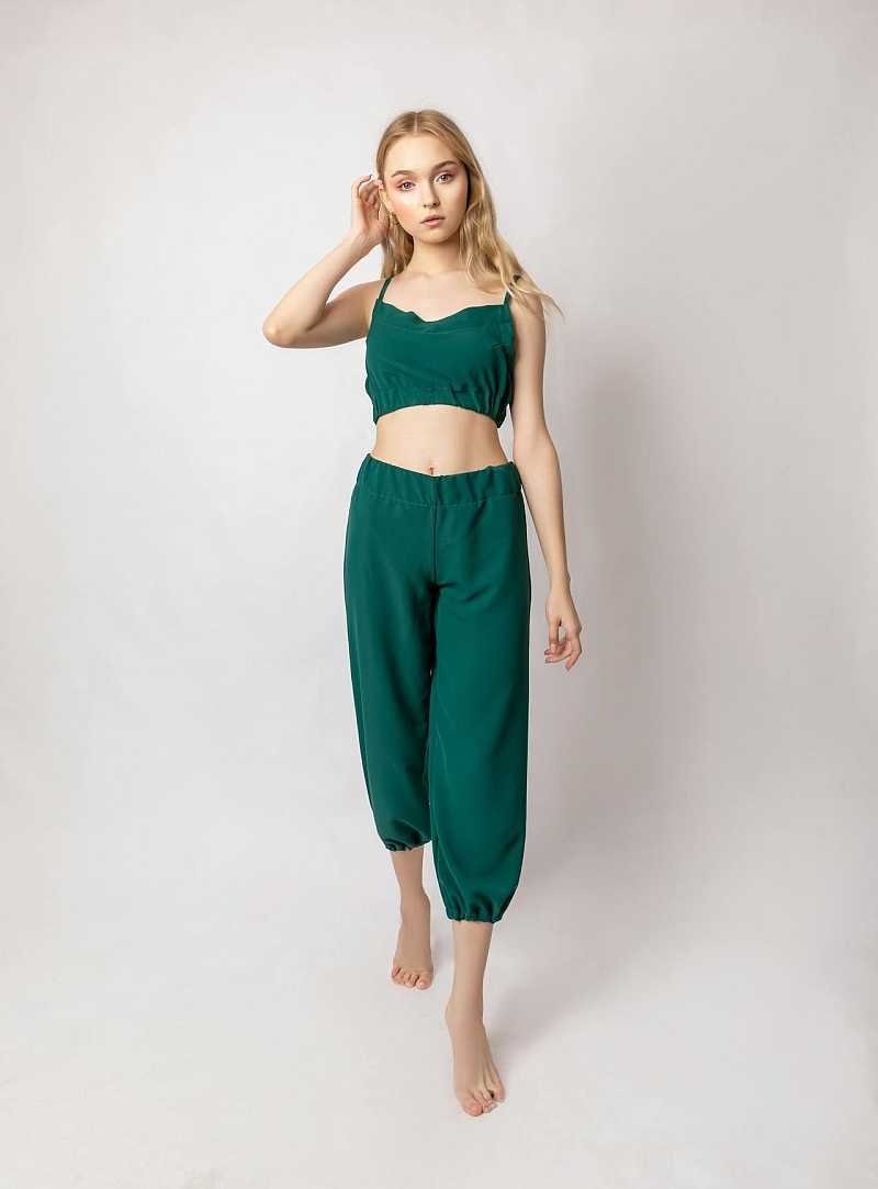 Tall and skinny woman in green