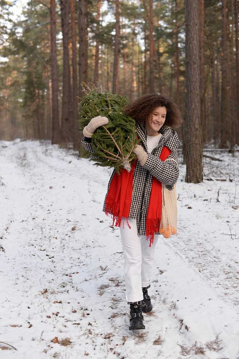 Woman in the forest wearing boots for winter